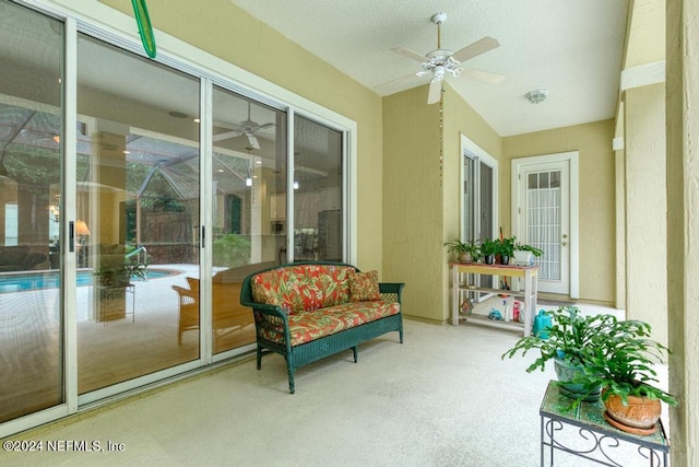 sunroom with ceiling fan