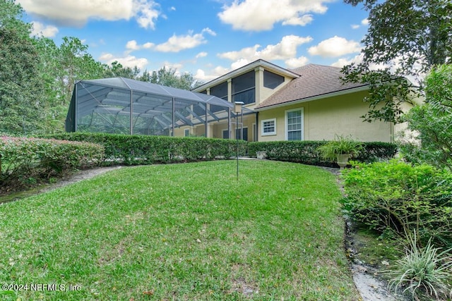 view of yard with a lanai