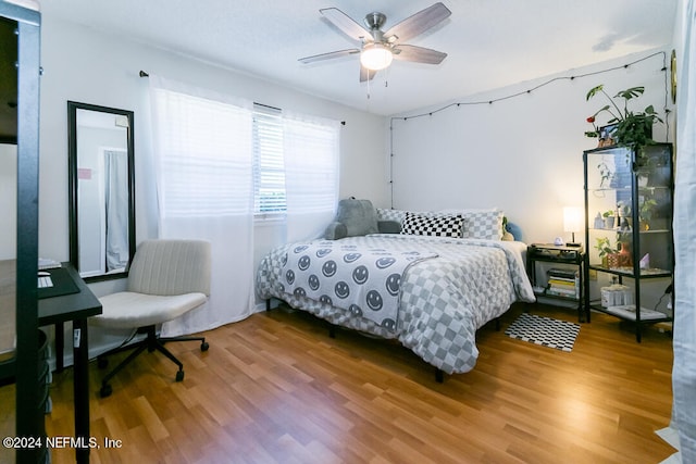 bedroom featuring wood-type flooring and ceiling fan