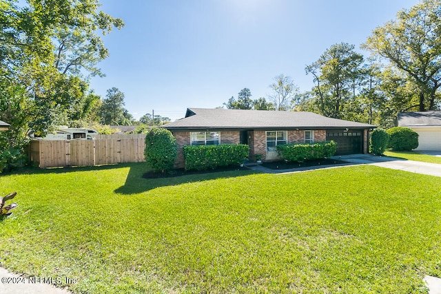 ranch-style house with a front lawn and a garage