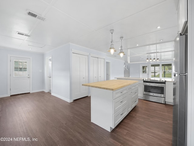 kitchen featuring white cabinetry, wooden counters, stainless steel appliances, and dark hardwood / wood-style floors