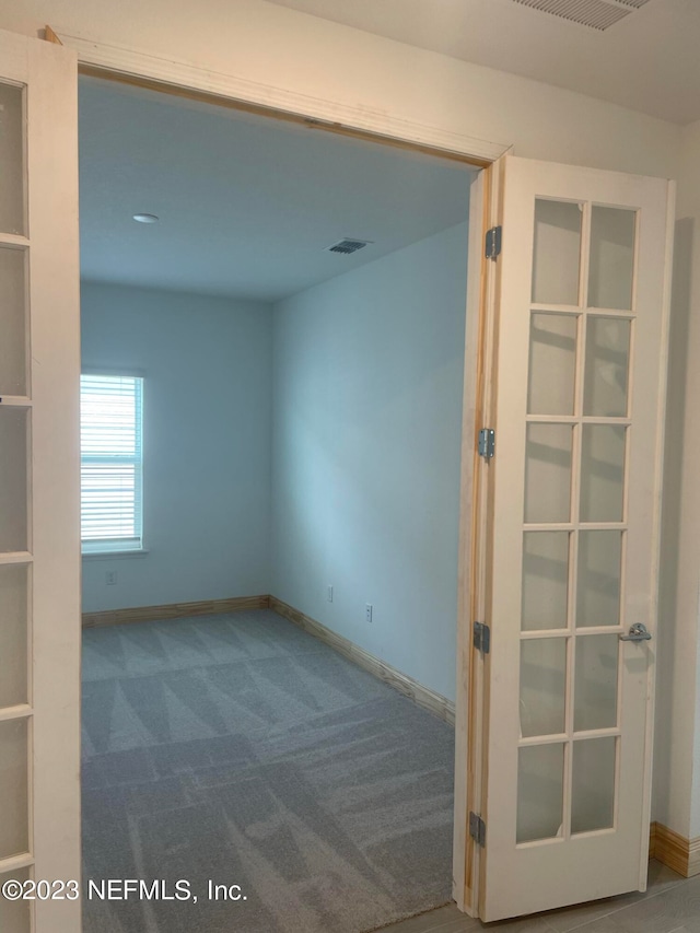 empty room with carpet flooring