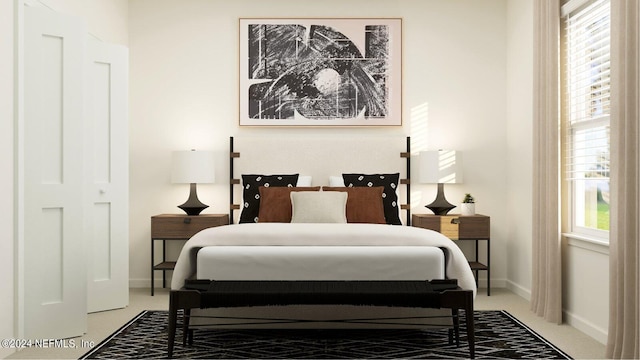 bedroom featuring baseboards and light carpet