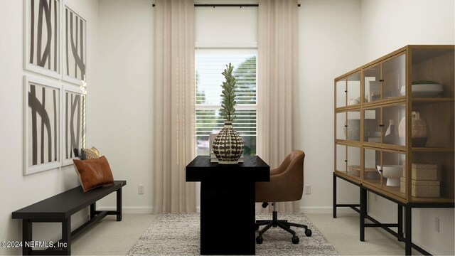 office area featuring baseboards and carpet