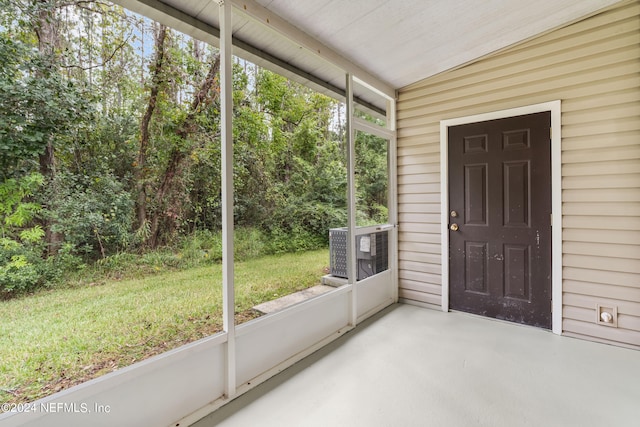 unfurnished sunroom with a wealth of natural light, lofted ceiling, and wooden ceiling