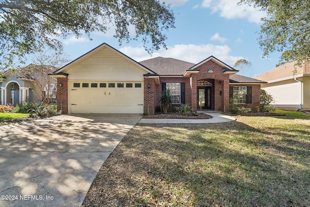 ranch-style house with a garage and a front yard