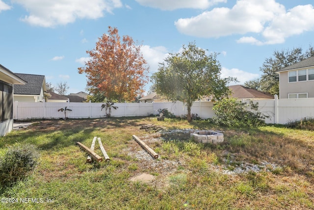 view of yard featuring a fire pit