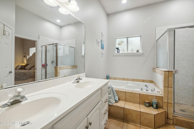 bathroom featuring tile patterned flooring, vanity, and plus walk in shower