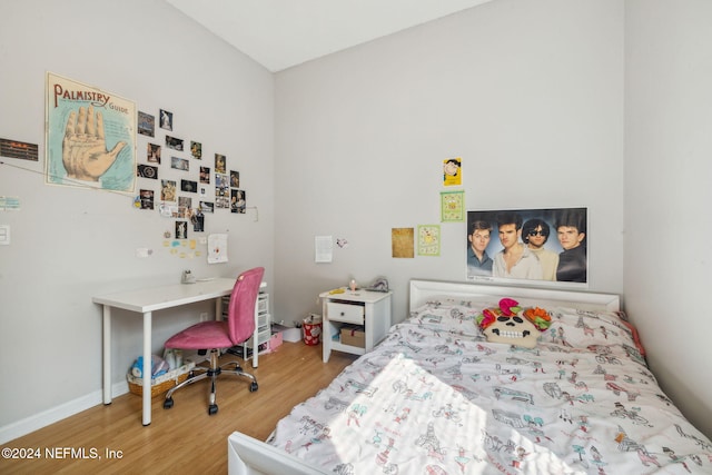 bedroom with wood-type flooring