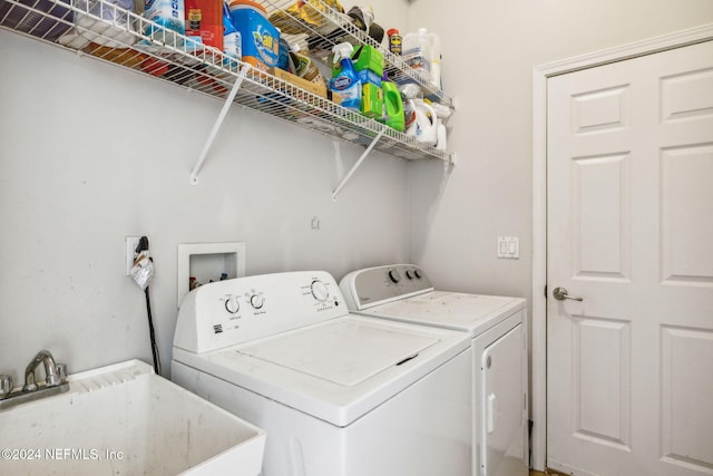 laundry room featuring separate washer and dryer and sink