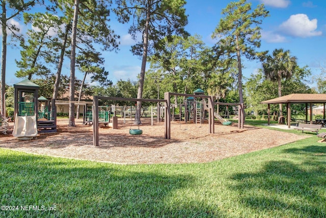 view of jungle gym featuring a lawn