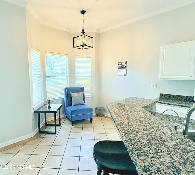 interior space with crown molding, a notable chandelier, and light tile patterned flooring