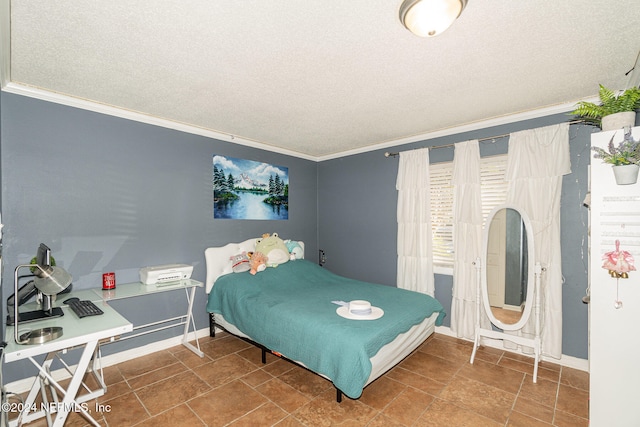 bedroom with crown molding and a textured ceiling