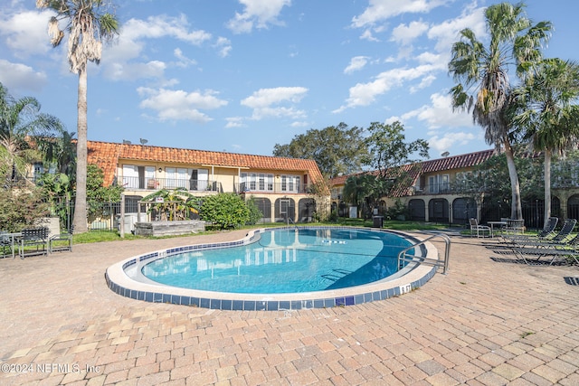 view of pool featuring a patio area