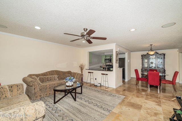 living room featuring ceiling fan, crown molding, and a textured ceiling