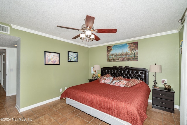 tiled bedroom featuring ceiling fan, ornamental molding, and a textured ceiling