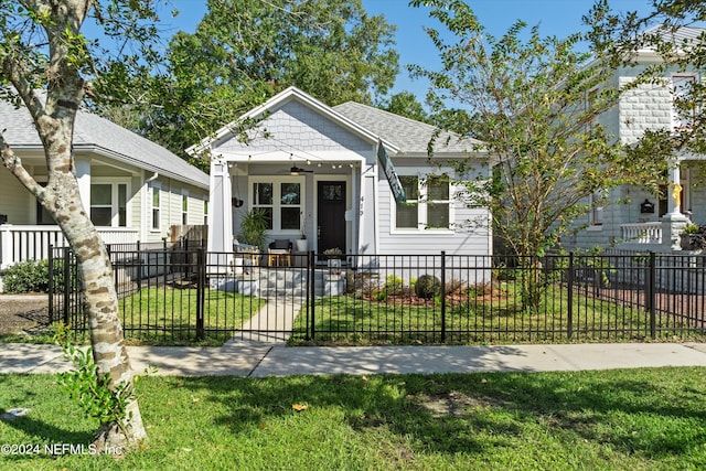 bungalow featuring a front yard