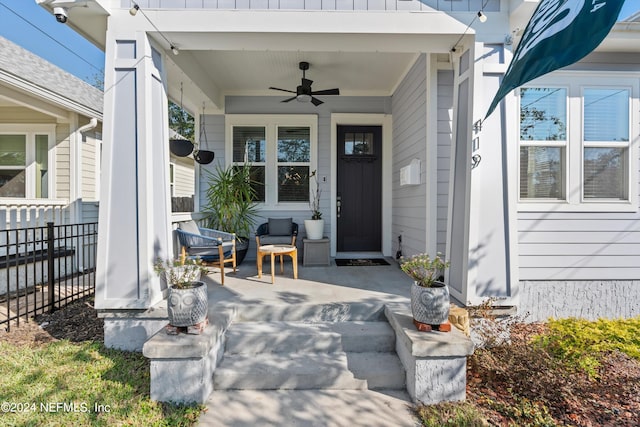 view of exterior entry featuring ceiling fan