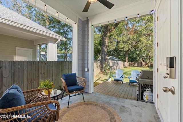 wooden deck with a patio and ceiling fan