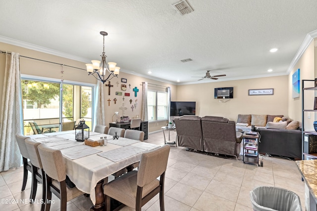 tiled dining space with crown molding, ceiling fan with notable chandelier, and plenty of natural light