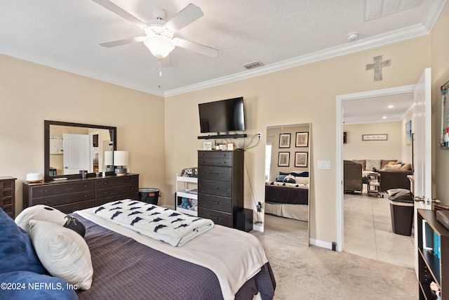 bedroom with light carpet, crown molding, a textured ceiling, and ceiling fan