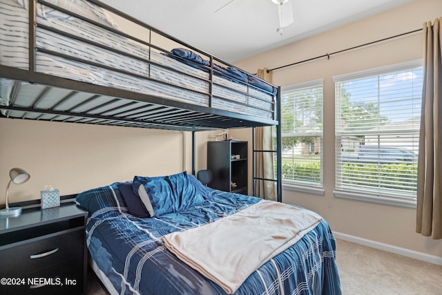 carpeted bedroom with ceiling fan