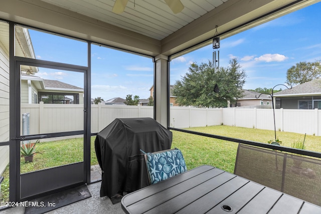 sunroom / solarium with ceiling fan