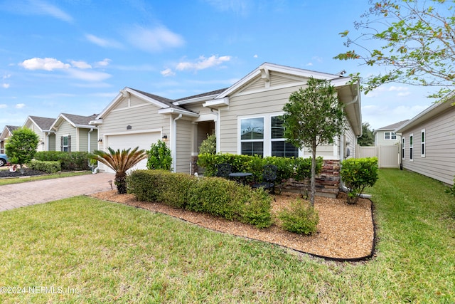 ranch-style house with a garage and a front lawn