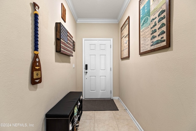 entryway featuring crown molding and light tile patterned flooring