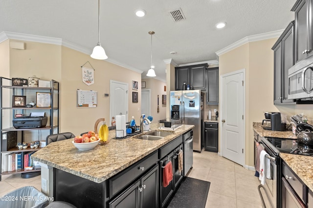 kitchen with crown molding, appliances with stainless steel finishes, sink, and a center island with sink