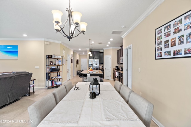 tiled dining space featuring an inviting chandelier and crown molding