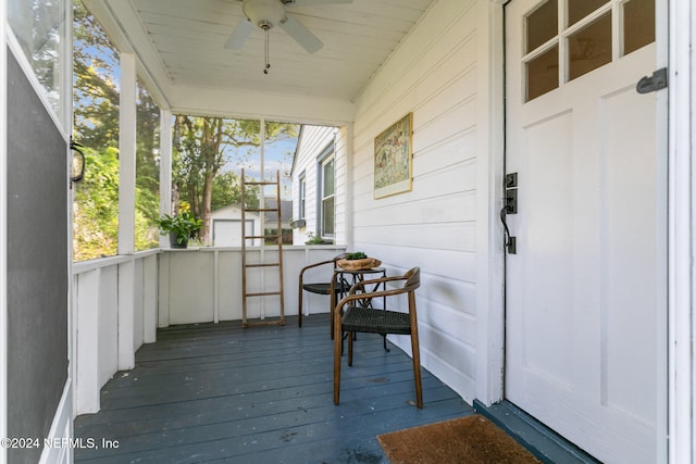 exterior space with ceiling fan