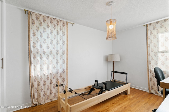 office area featuring a textured ceiling and hardwood / wood-style flooring