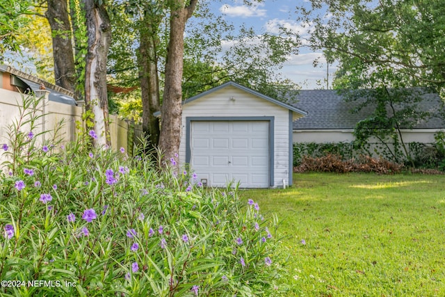 garage with a yard