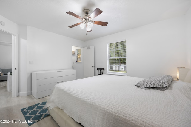 bedroom with ceiling fan and light hardwood / wood-style floors