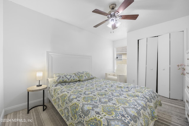 bedroom featuring wood-type flooring, a closet, and ceiling fan