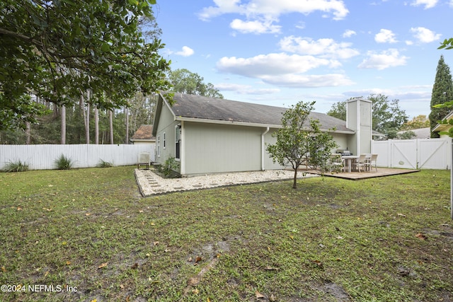 exterior space featuring a lawn and a patio area