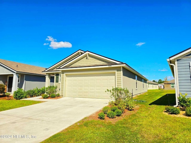 view of front of home featuring a front yard and a garage