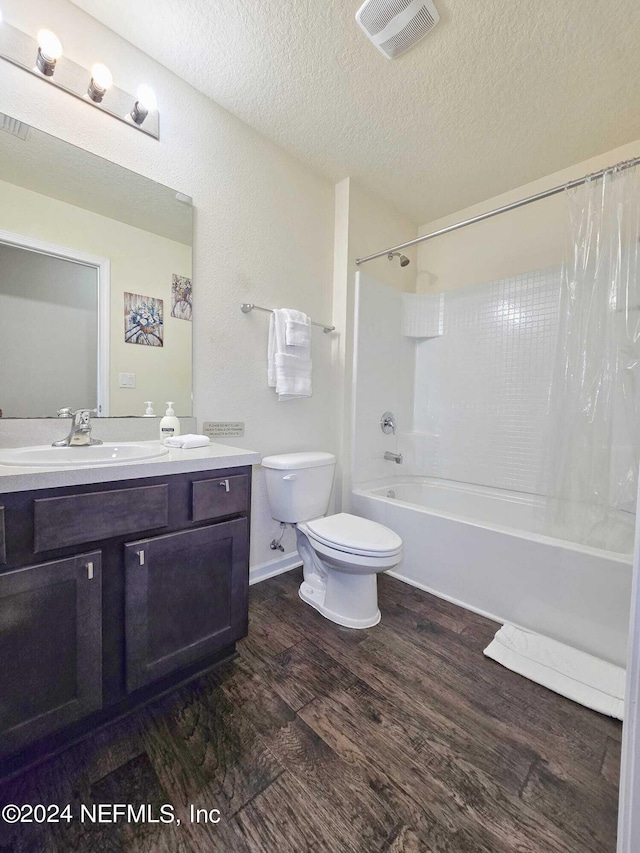 full bathroom featuring toilet, vanity, shower / bath combo, and wood-type flooring