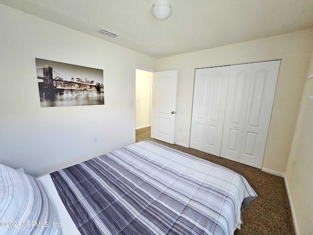 carpeted bedroom with a closet