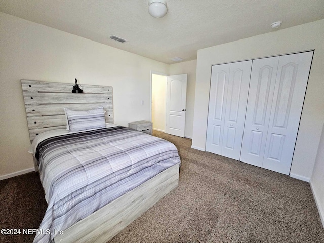 bedroom featuring a closet and carpet