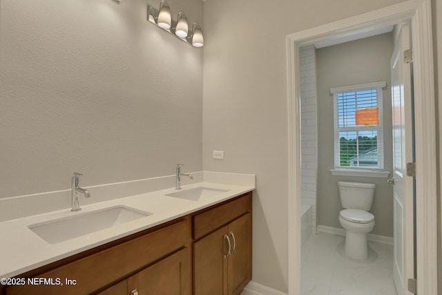 bathroom with vanity and toilet