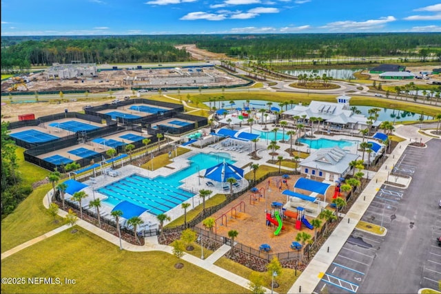 birds eye view of property with a water view