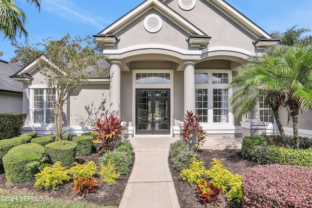 property entrance featuring french doors