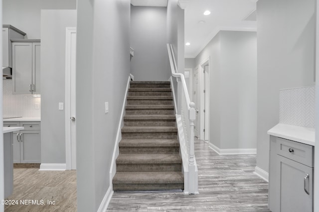 stairway featuring hardwood / wood-style flooring