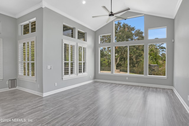 interior space featuring ceiling fan, lofted ceiling, and a wealth of natural light