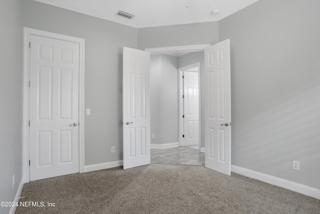 unfurnished bedroom featuring carpet flooring