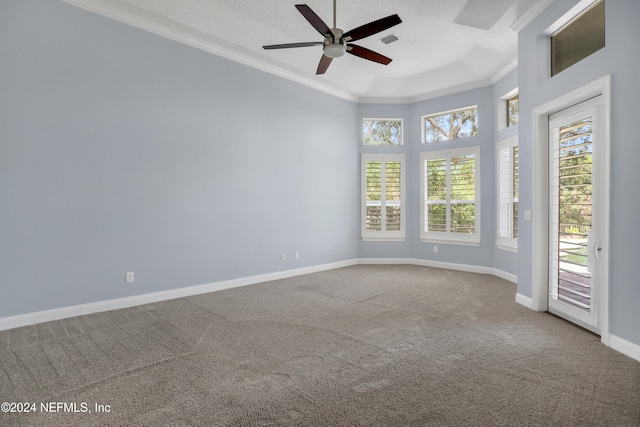 empty room with crown molding, carpet flooring, a textured ceiling, and ceiling fan