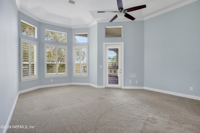 carpeted empty room featuring ornamental molding and ceiling fan