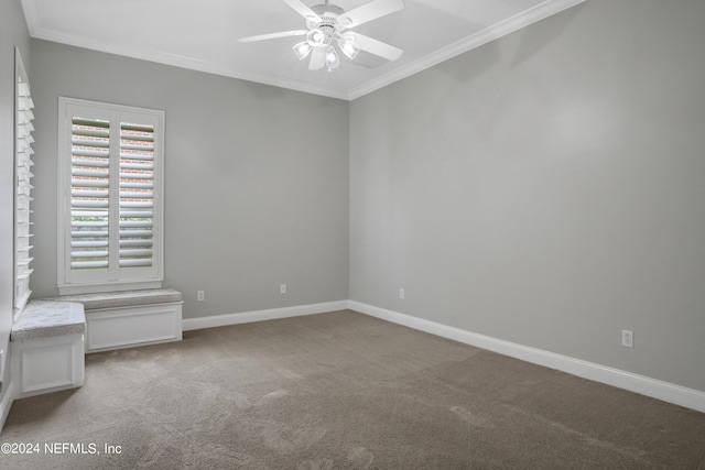 unfurnished room featuring crown molding, light colored carpet, and ceiling fan